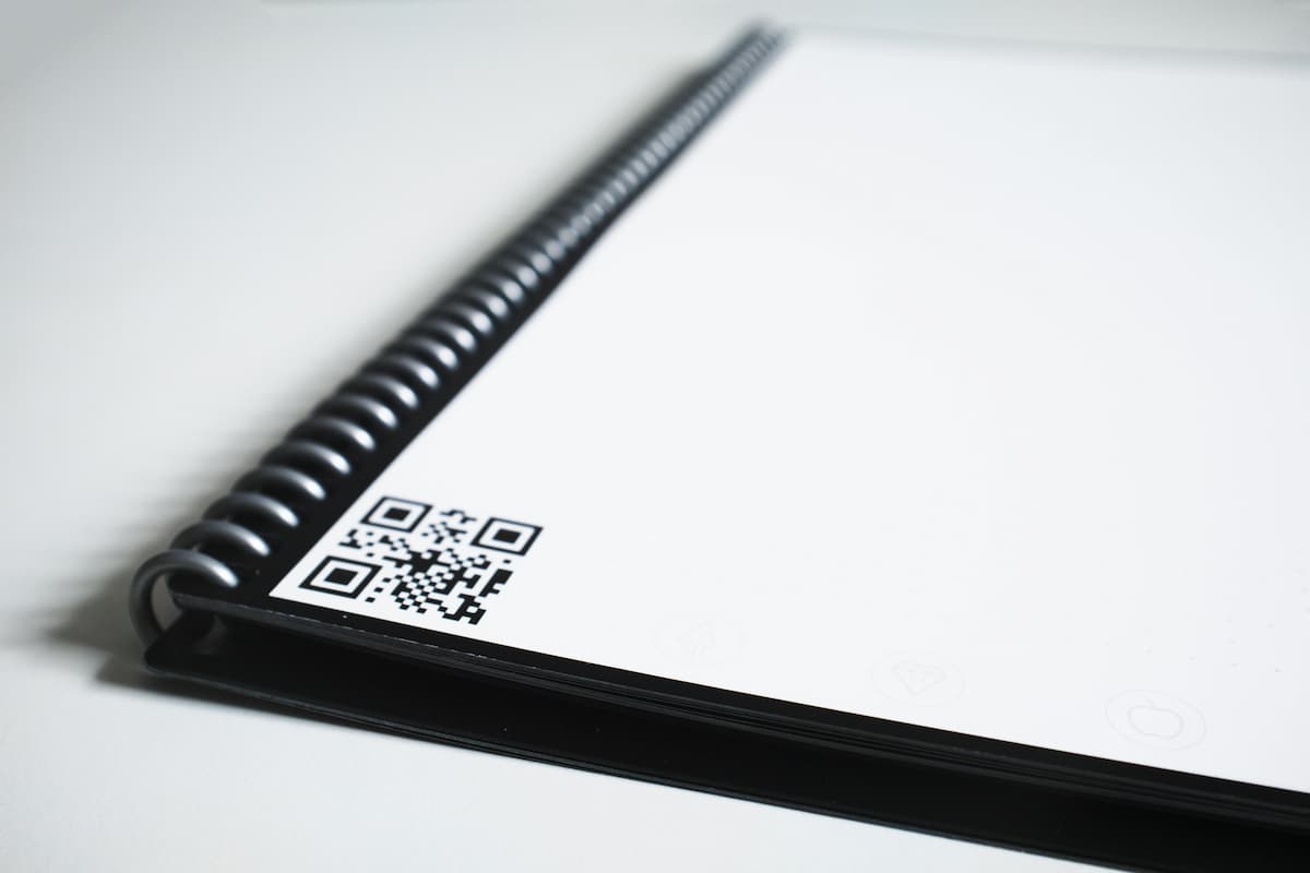 Notebook with QR code printed on the corner of the page