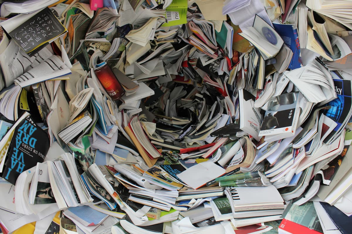 Tornado of books and magazines with a variety of paper types and weights