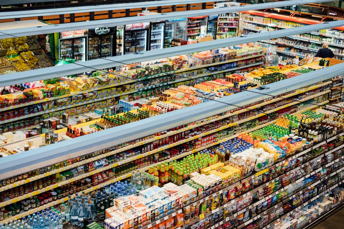 Grocery store shelves with price tags